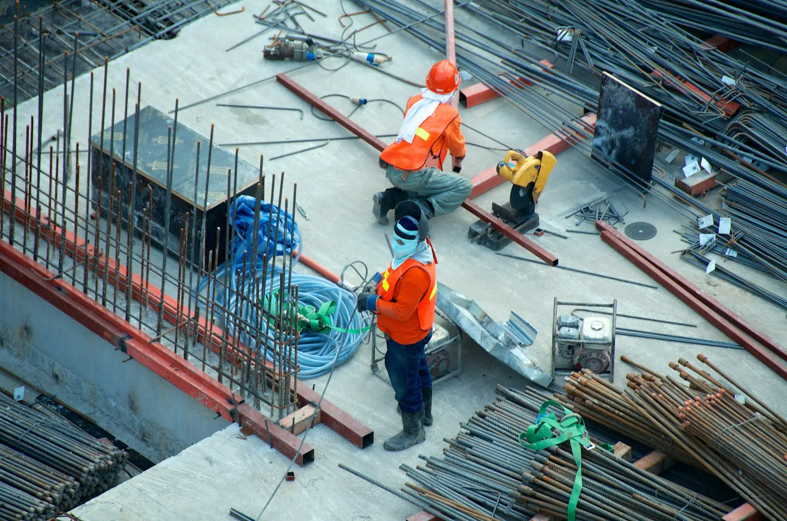 Roofer on a ladder performing targeted roof repair work