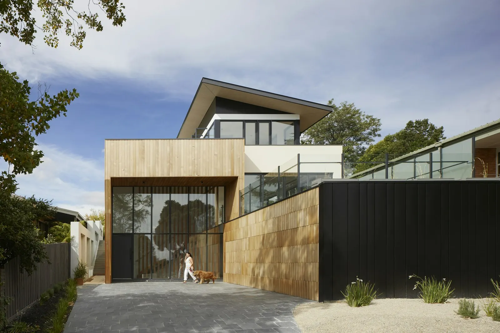 Modern home with clean dark standing-seam metal roof lines